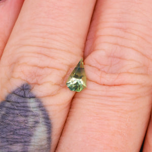 Create your own ring: 0.67ct green/bicolor elongated shield cut sapphire
