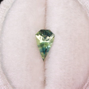 Create your own ring: 0.67ct green/bicolor elongated shield cut sapphire