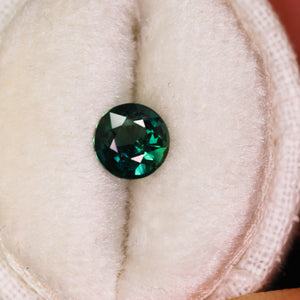 Create your own ring: 0.88ct dark teal round sapphire