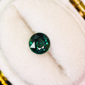 Create your own ring: 0.88ct dark teal round sapphire