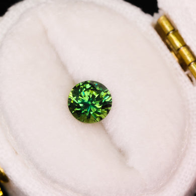 Create your own ring: 0.94ct round green/bicolor sapphire