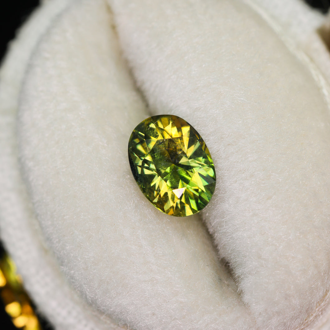 Create your own ring: 1.29ct bicolor hazel/green oval sapphire