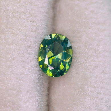 Create your own ring: 0.64ct green oval brilliant cut sapphire
