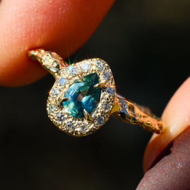 Valkyrie: 14K teal sapphire and grey diamond halo ring