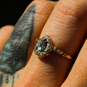 Valkyrie: 14K teal sapphire and grey diamond halo ring