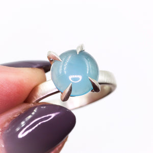 "Mirth": Chalcedony cocktail ring with heavy talon claw prongs (size7; one of a kind)